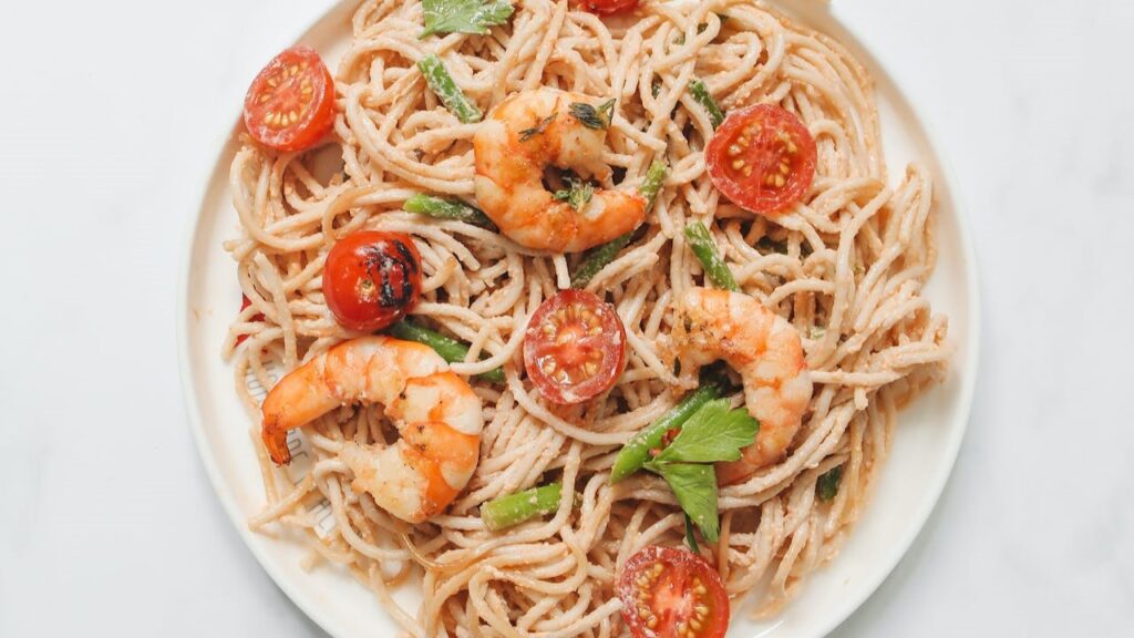 Shrimp Scampi Linguine elevates the pasta experience with succulent shrimp cooked in a lemon-garlic butter sauce, often complemented by a splash of white wine. The dish strikes a perfect balance between refreshing and indulgent flavors.